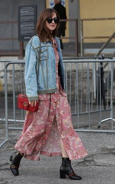 a woman in a pink dress and denim jacket