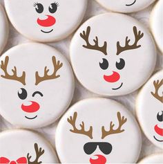 some white buttons with reindeer faces painted on them