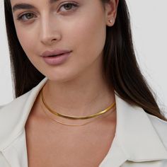 Finish off any look with this sleek and minimalist layered necklace. Beautifully designed to elevate any outfit effortlessly, this necklace is a must-have.  Made with waterproof stainless steel, you never need to worry about fading or tarnishing jewelry ever again! Waterproof & tarnish-free Stainless steel 18K gold Minimalist Gold Choker With Double Chain, Minimalist Gold Double Chain Choker, Minimalist Tarnish-resistant Herringbone Necklace, Everyday Layered Choker Jewelry, Modern Herringbone Necklace, Tarnish Resistant, Everyday Layered Choker, Double Strand Clavicle Chain Choker For Layering, Minimalist Double Chain Herringbone Necklace, Dainty Herringbone Necklace For Layering With Clavicle Chain