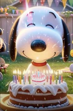 a birthday cake with candles and a dog on it