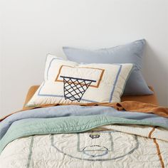 a bed topped with two pillows and a pillow case