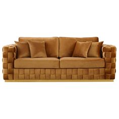 a brown couch with several pillows on it's back and sides, in front of a white background