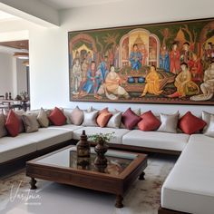 a living room filled with furniture and a painting on the wall