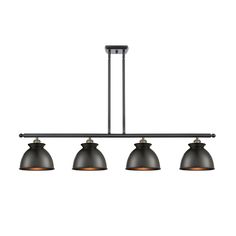 three lights hanging from the ceiling in an industrial style light fixture with black metal shades