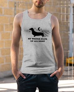 a man wearing a tank top that says, my wiener wants up all night