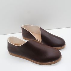 The Keiko is a translation of our most popular Sandy style to this much more casual roundtoe. A stitched back and roomy front, along with a rubberized sole make it a go to style for many occasions. This style features a removeable insert. The foam layer can be removed/replaced for a wider fitting shoe (we suggest to glue down the leather layer). Our new method of shoemaking has a double layer stitched back seam to provide heel structure without gripping the ankle. Made with our own olive leaf ta Leather Closed Toe Slip-ons With Stitched Sole, Leather Slip-on Shoes With Stitched Sole, Brown Closed Toe Slip-ons With Stitched Sole, Red Closed Toe Slip-ons With Leather Sole, Slip-on Leather Clogs With Stitched Sole, Olive Leaf, Double Layer, Most Popular, Make It