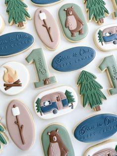 decorated cookies are arranged in the shape of trees, campers, and rvs