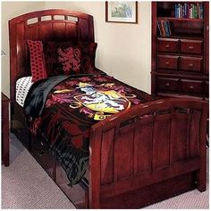 a bed with a wooden headboard and foot board in a small room next to a dresser