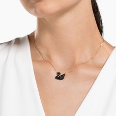 This elegant rhodium-plated pendant features Swarovski’s legendary swan motif. Delicately embellished with dramatic black crystals set in our innovative Pointiage® technique, it sparkles softly enough to complement any work or leisure outfit. The pendant measures 1 x 1 cm and the chain is 38 cm. Layer it with the rose gold-plated Iconic Swan Pendant for an on-trend mixed metal look. Article no.: 5347329 Length (minimum - maximum): 14.96 - 17.32 inch Motif size: 0.55 x 0.67 inch Material: Crystal Swan Jewelry, Swan Pendant, Swan Design, Swan Necklace, Swarovski Swan, Minimal Necklace, Swarovski Necklace, Wear Necklaces, Rose Gold Chain