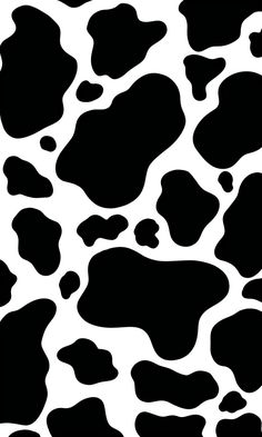 a black and white cow print pattern that looks like it has spots on the surface