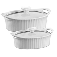 two white casserole dishes sitting side by side