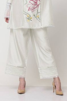 White kurta with floral thread embroidery embellished by pearl and scalloped lace. Comes with pant. - Aza Fashions Embroidered Bottoms For Summer Wedding, White Floral Embroidery Bottoms For Wedding, Embroidered Summer Wedding Bottoms, Summer Wedding Embroidered Bottoms, Traditional Sets With Embroidered Hem For Spring, Traditional Festive Sets With Embroidered Hem, Traditional Spring Sets With Embroidered Hem, Embroidered Pants For Summer Wedding, Embroidered Sets For Spring