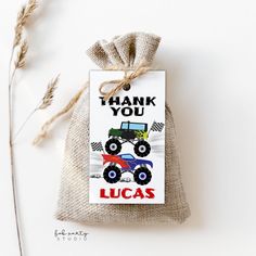 a bag with a monster truck on it and the words thank you lucas printed on it