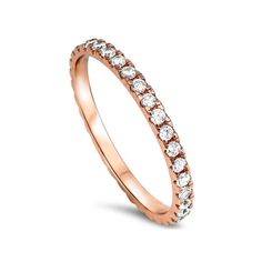 a rose gold ring with rows of round diamonds on the side, set against a white background