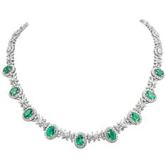 Beautiful emerald and diamond necklace. 19.10 carats total gemstone weight. 9 oval shaped emeralds, 6.53 carats, apx F2. 805 round and baguette cut diamonds, approximately G/H color and VS2/SI1 clarity. 18k white gold, 33.58 grams, 16.5 inches. Accommodated with an up-to-date appraisal by a GIA G.G. once purchased, upon request. Please contact us with any questions. Item Number N6682 Gucci Necklace Gold, Flat Gold Necklace, Emerald Jewelry Necklace, Emerald Diamond Necklace, Emerald And Diamond Necklace, Black Gold Necklace, Silver Coin Necklace, Star Necklace Silver, Silver Choker Necklace