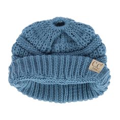 This adorable beanie is crafted from soft, warm cable knit fabric, making it perfect for chilly winter days. Designed with an opening at the top, this beanie allows her to wear her ponytail or messy bun comfortably, giving her the freedom to keep her favorite hairstyle while staying snug and warm. Whether she is playing in the snow, heading to school, or just out and about, this beanie is a versatile and stylish accessory that pairs easily with any winter outfit. Made of 100% Acrylic Playing In The Snow, Fabric Making, Favorite Hairstyles, Winter Beanie, Winter Days, Winter Day, Winter Knits, Messy Bun, Winter Outfit