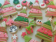 decorated cookies are arranged on a table