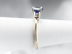 This is a classic engagement ring with clean lines and great proportions! This ring is quite traditional, featuring a solid gold head to hold the stone securely. Polished yellow gold shoulders complete the simple look. We've set this versatile piece with an intense sapphire, an exquisite cornflower blue that is bright and shining. The value of this gem is found in its quality - this is a benchmark gem, of the ultimate color and clarity that other sapphires can be compared against. Metal: 14K Yel Timeless 14k Gold Solitaire Sapphire Ring, Heirloom Solitaire Sapphire Ring In 14k Gold, Heirloom Gold Sapphire Solitaire Ring, 14k Gold Sapphire Solitaire Jewelry, 14k Gold Solitaire Sapphire Jewelry, Engagement Ring Classic, Yellow Gold Sapphire Ring, Sapphire Solitaire Ring, Classic Engagement Ring