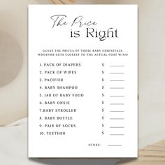 the price is right game card on top of a wooden table with white linens