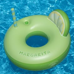 an inflatable ring floating on top of a pool with a lemon slice inside