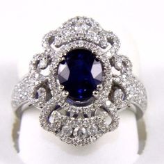 This Is A Fine Oval Blue Sapphire Ring W/Diamond Halo & Accents. It Is Made Of 100% Natural 14kt White Gold And Is In Brand New Condition. It Has A Ctw Of 2.55ct (0.90 Diamond/1.65 Sapphire) And Weighs 5.8 Grams. The Fancy Diamonds Have A Clarity Of Si2 And G Color. This Beautiful Custom Piece Has An Excellent Oval Cut Blue Sapphire Gemstone, Surrounded By A Double Diamond Halo With Accents. This Ring Is The Latest In Fashion Design Having Unique Designer Qualities That Is Full Of Shine Exquisite Silver Sapphire Ring In 14k White Gold, Exquisite 14k White Gold Sapphire Ring, Oval Diamond White Sapphire Ring In 14k White Gold, 14k White Gold Sapphire Birthstone Ring, Dazzling White Gold Sapphire Ring In Platinum, Classic Blue Diamond Ring In 14k White Gold, Exquisite Brilliant Cut Sapphire Ring In 14k White Gold, Exquisite 14k White Gold Brilliant Cut Sapphire Ring, Gia Certified Silver Sapphire Ring In 14k White Gold