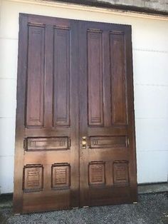 two wooden doors sitting next to each other