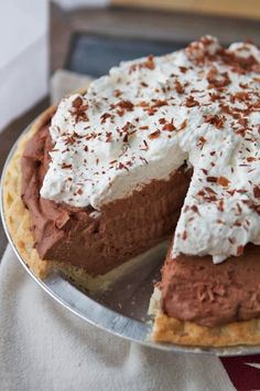 a chocolate pie with whipped cream on top