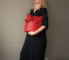 Red hobo bag faux leather handmade.  Height - 32 cm  (12,59 ") Top width from seam to seam - 33 cm  (12,99 ") Bottom width - 23 cm ( 9,06 " ) Depth - 10 cm   (3,93 ") Handle - 56 cm  (22,04 ") Red orange brick color hobo bag is made of faux leather. Red orange bag has a cotton lining, 1 large pocket outside, 2 pockets inside. Hobo bag is very beautiful and stylish. Dark orange (red brick) color is very popular. Fashion red shoulder bag for women fastens with magnetic button. Women's red orange handbag. Large red shoulder bag handmade. Medium size red hobo bag. City fashion red orange hobo bag faux leather. Street style red orange shoulder bag unisex. Unique red hobo bag. Minimalist red hobo bag faux leather unisex. Handmade red orange hobo bag great gift! Orange Handbag, Red Shoulder Bag, Orange Brick, Brick Colors, Red Handbag, Popular Fashion, Dark Orange, Orange Bag, Red Bricks