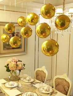 a dining room table with plates and silverware on it, hanging from the ceiling