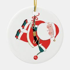 a christmas ornament with santa claus on it's chest and feet hanging from a string