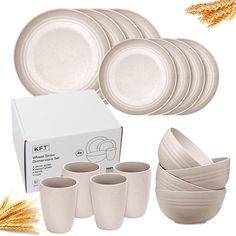 a set of white dinnerware with wheat stalks in the foreground and an empty box on the right