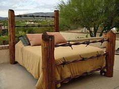 a bed made out of wood and barbed wire