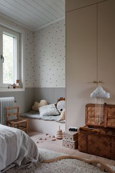 a bedroom with a bed, dresser and other items in the room on the floor