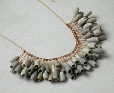 a necklace made out of white and black beads