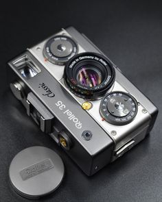 an old fashioned camera sitting on top of a table