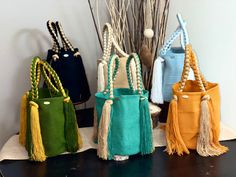 this bags are part of our Kashï Collection. Unique & 100% Original Wayuu bag handwoven by the indigenous members from the Wayuu tribe in La Guajira, Colombia trough a ancient process that is been passed from Generations to generations and have become the mainly economic support for their families. Some of this bags takes up from days up to 3 weeks of work to be finished and is woven using a double thread ancient technique. Each of this bags reflects their lifestyle & culture and is a way to show Rectangular Woven Bags As Gift, Rectangular Woven Bags As Gifts, Rectangular Weaved Bags As Gifts, Rectangular Weaving Bags As Gifts, Artisan Gift Bag In Natural Color, Artisan Natural Color Gift Bag, Rectangular Handwoven Bucket Bag As Gift, Artisan Handwoven Beach Bag For Gift, Artisan Handwoven Beach Bag As Gift