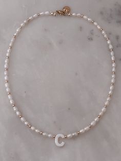 Handmade Necklace. Length: 16” Freshwater pearls. Elegant Pearl Jewelry With Letter Beads, Adjustable White Pearl Necklace For Everyday, Adjustable White Chain Necklace With Pearl Charm, Adjustable Pearl Drop Chain Necklace Gift, White Pearl Beaded Necklace With Adjustable Chain, Adjustable Pearl Beaded Necklace, Adjustable Pearl Beaded Necklaces, Everyday White Pearl Necklace With Adjustable Chain, Adjustable Pearl Necklace For Everyday