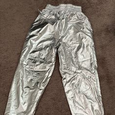 Oh Polly Metallic Joggers Silver Shiny Bottoms For Spring, Casual Silver Bottoms For Streetwear, Spring Silver Shiny Bottoms, Trendy Silver Pants For Spring, Silver Metallic Joggers Outfit, Casual Shiny Metallic Bottoms, Metallic Full-length Pants For Night Out, Trendy Metallic Full-length Pants, Silver Stretch Full-length Bottoms