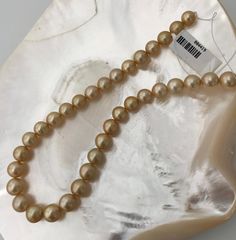 "Beautiful 8-10mm Golden South Sea Cultured Pearl of Natural Color Strand. Strand has high luster, with slight birth marks and well matched. Take advantage of this unique opportunity. You can choose between Rhodium plated 925 Silver clasp or 18k Gold plated 925 Silver clasp, real solid silver not gold filled! If you would like a Certificate of Authenticity included with your order please message us. Pearl Type: Cultured Golden South Sea Pearl Color: All Natural Gold, High Luster with slight birt Classic Pearl Necklace With Polished Beads, Classic 8mm Bead Pearl Necklace For Formal Occasions, Classic Formal Pearl Necklace With 8mm Beads, Formal Polished Pearl Necklace, Classic Gold Pearl Necklace With 8mm Beads, Formal Pearl Necklace With 8mm Beads, Luxury High Luster Round Pearl Necklace, High Luster Round Akoya Pearl Necklace, High Luster Yellow Gold Pearl Necklace With Round Beads