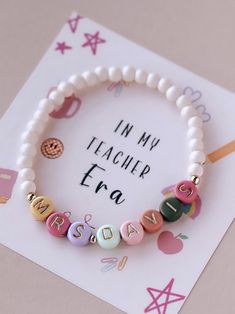 a bracelet that says in my teacher era on it