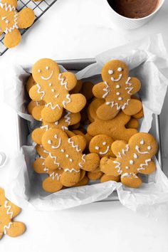 ginger cookies with white frosting in a box