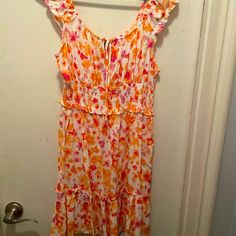 Never Worn White Dress With Colorful Flowers Of Oranges, Pinks, And Yellows. This Dress Is In A Size Large. White Floral Print Sundress For Vacation, White Ditsy Floral Print Dress For Daywear, Spring White Sundress With Ditsy Floral Print, White Ditsy Floral Print Sundress For Spring, White Ditsy Floral Print Dress, Multicolor Floral Casual Dress For Daywear, Casual Multicolor Floral Dress For Daywear, White Floral Ruffled Dress For Beach, White Floral Dress With Ruffles For Beach