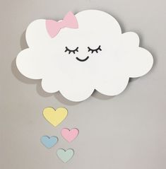 a white cloud with pink, yellow and blue hearts on it's side that says gabiella