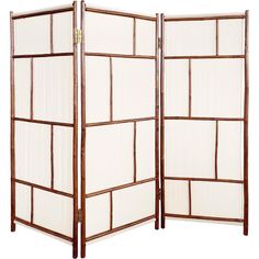 a room divider made out of wood and white fabric