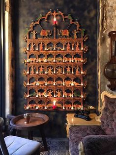 an ornate wooden shelf with candles on it