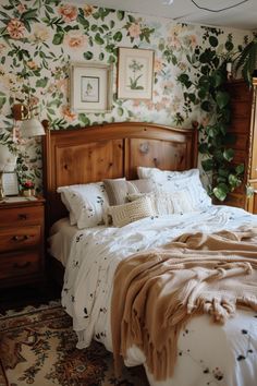 a bedroom with floral wallpaper and wooden headboard, bedding is neatly made