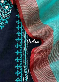 an image of a blue and red scarf with the name saharn on it