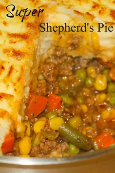 a close up of food in a pan with the words shepherd's pie on it