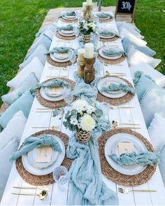 a long table set with plates and place settings