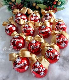 twelve personalized christmas ornaments in red and gold